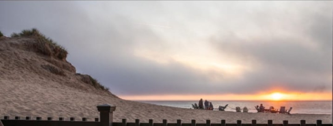 Wine evening on the beach at sunset