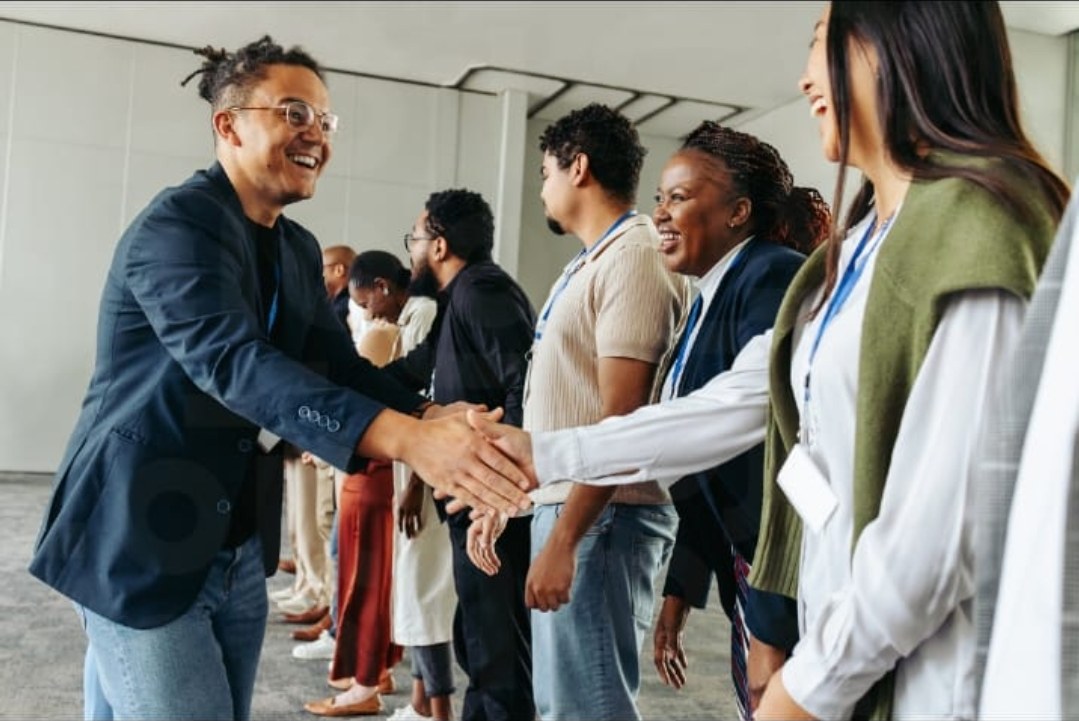 Welcoming guests at a corporate event