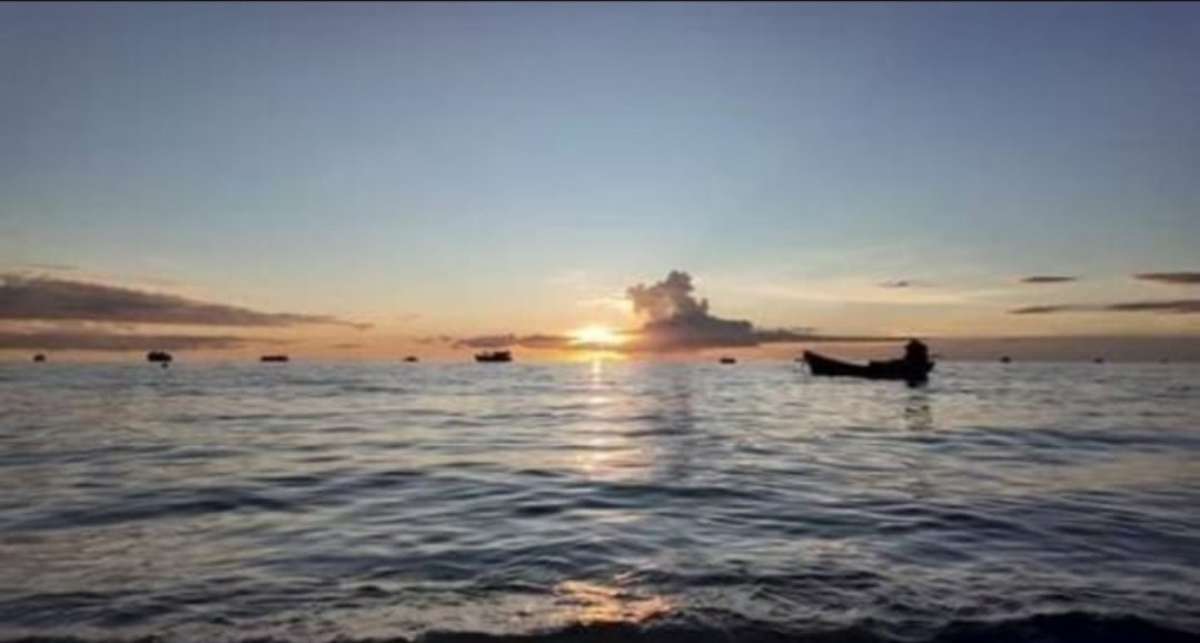Boat silhouette against the sunset